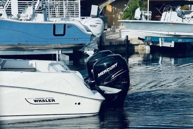  Yacht Photos Pics 2016 Boston Whaler 320 Outrage with Mercury engine docked in marina.
