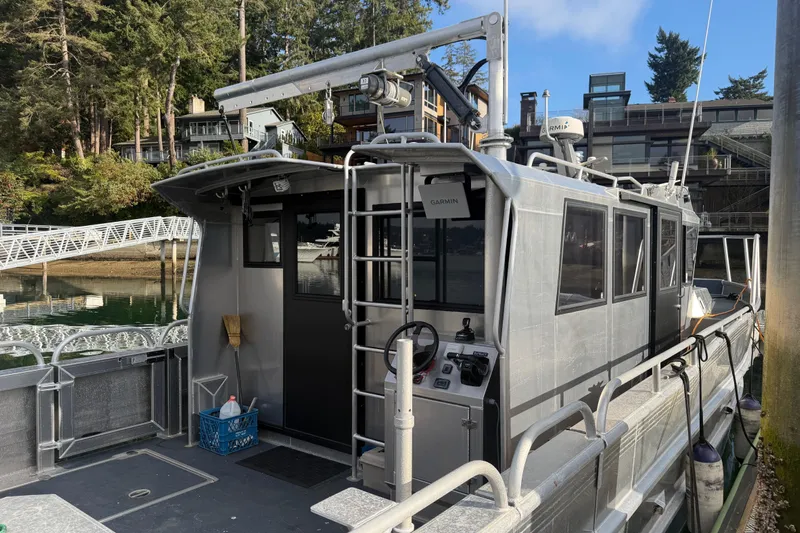 C Lady Yacht Photos Pics 2020 Armstrong Marine 35 boat docked near waterfront homes and lush trees.