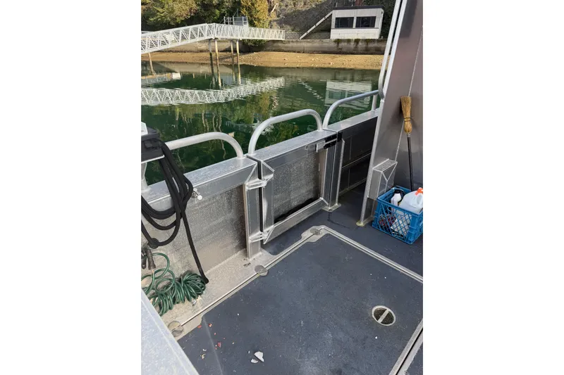 C Lady Yacht Photos Pics 2020 Armstrong Marine 35 boat deck with cleaning supplies and dock view.