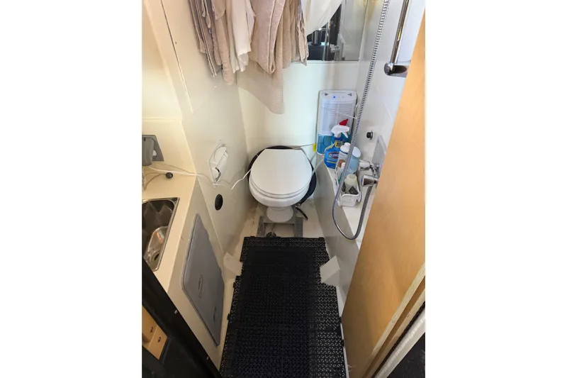 C Lady Yacht Photos Pics Compact bathroom in a 2020 Armstrong Marine 35 boat, featuring a toilet and sink.