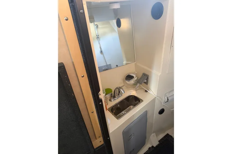 C Lady Yacht Photos Pics 2020 Armstrong Marine 35 interior bathroom with sink, mirror, and compact design.