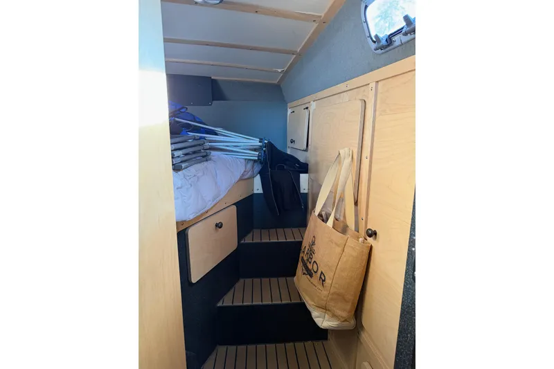 C Lady Yacht Photos Pics Interior of 2020 Armstrong Marine 35 boat with wooden cabinetry and storage space.