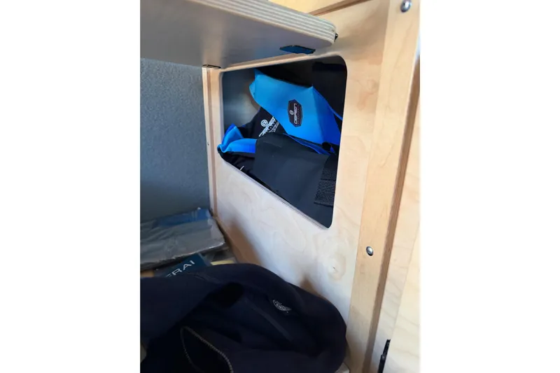 C Lady Yacht Photos Pics Storage compartment in 2020 Armstrong Marine 35 boat with blue and black gear.
