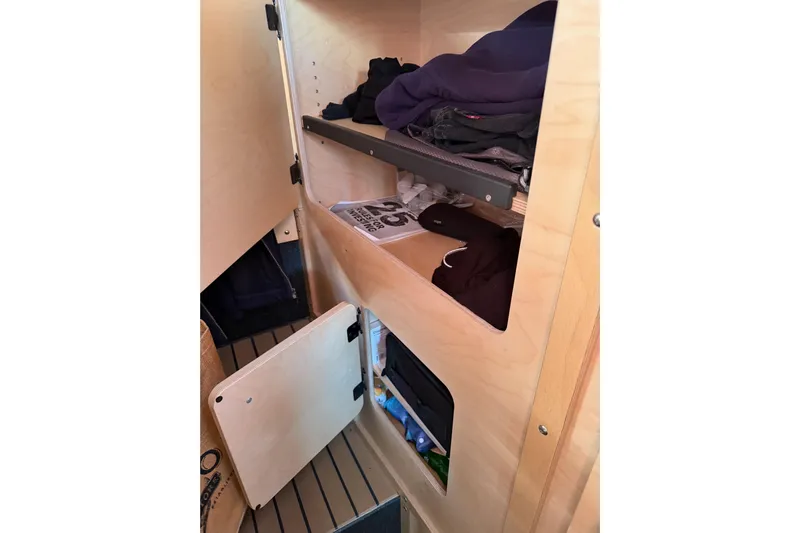 C Lady Yacht Photos Pics Interior storage of 2020 Armstrong Marine 35 boat with shelves and clothing.