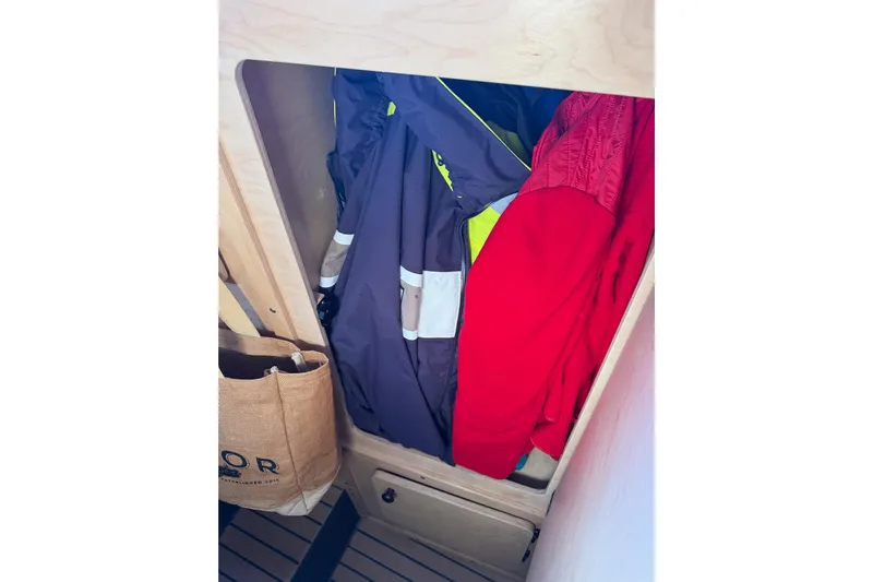 C Lady Yacht Photos Pics Storage area with jackets and a bag inside a 2020 Armstrong Marine 35 boat.