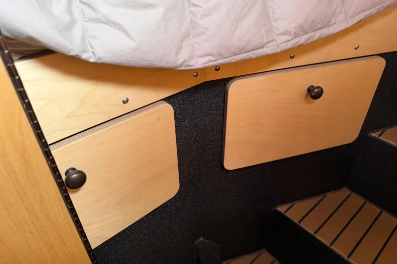 C Lady Yacht Photos Pics Interior of 2020 Armstrong Marine 35 boat with wooden storage compartments.