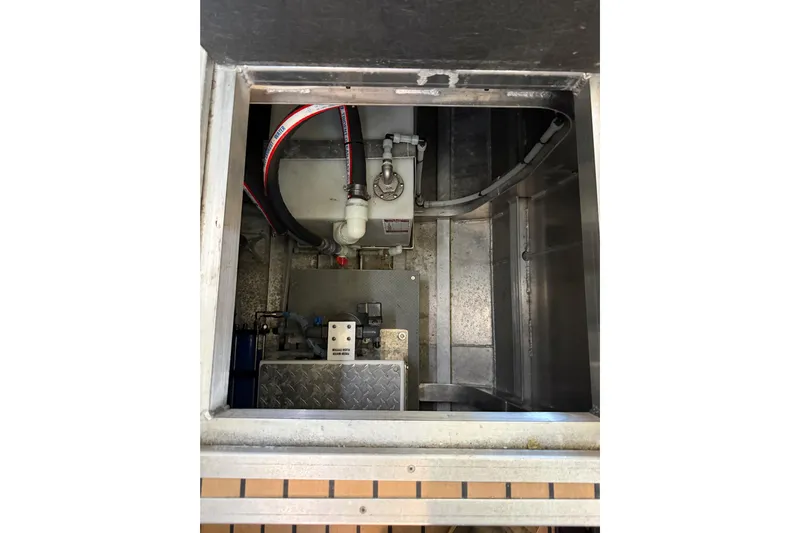 C Lady Yacht Photos Pics Engine compartment of a 2020 Armstrong Marine 35 boat, showing mechanical components and hoses.