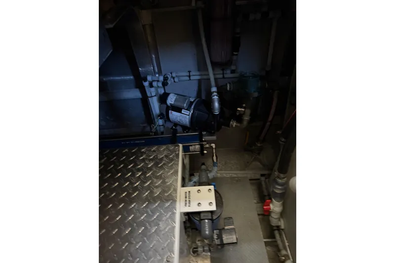 C Lady Yacht Photos Pics Engine room of 2020 Armstrong Marine 35 boat, featuring mechanical components and piping.