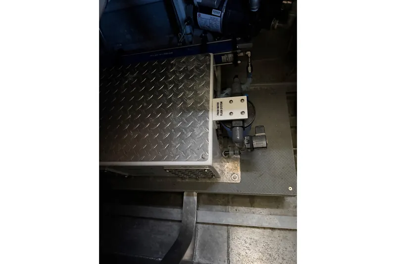 C Lady Yacht Photos Pics Engine compartment of 2020 Armstrong Marine 35 boat with metal flooring and components.