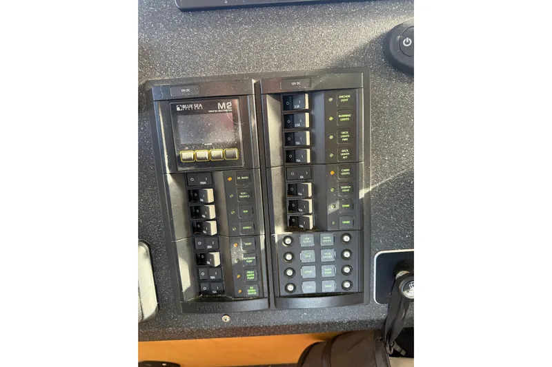 C Lady Yacht Photos Pics Control panel of a 2020 Armstrong Marine 35 boat with switches and display.