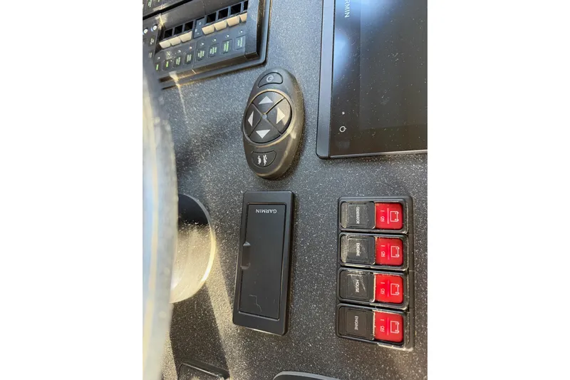 C Lady Yacht Photos Pics Control panel of 2020 Armstrong Marine 35 boat with Garmin device and switches.