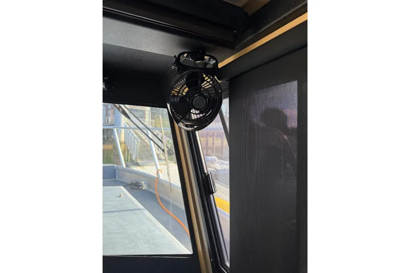 C Lady Yacht Photos Pics Interior of 2020 Armstrong Marine 35 boat with mounted fan and window view.