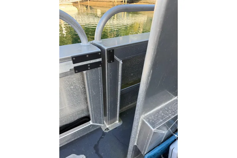 C Lady Yacht Photos Pics Close-up of Armstrong Marine 35 boat railing, 2020 model, near water.