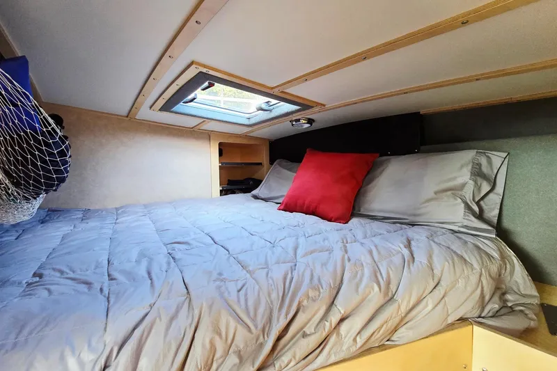 C Lady Yacht Photos Pics Cozy cabin interior of 2020 Armstrong Marine 35 with skylight and comfortable bedding.