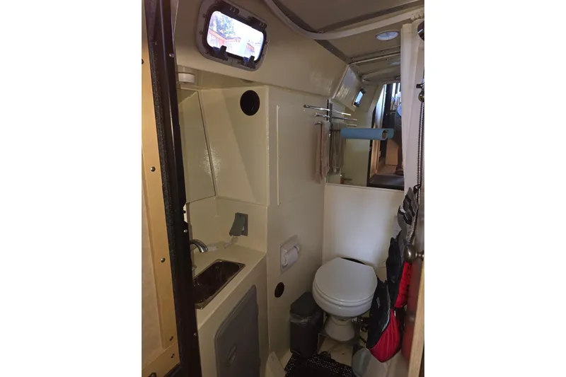 C Lady Yacht Photos Pics Compact bathroom interior of 2020 Armstrong Marine 35 boat, featuring sink and toilet.