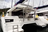 Leopard 50 catamaran, 2020 model, docked at marina with spacious deck and seating area.