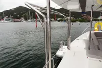 Leopard 50 yacht docked in a marina with scenic mountain backdrop, 2020 model.
