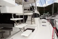 Modern Leopard 50 yacht, 2020 model, docked at marina with sleek white design.