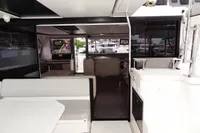 Interior view of 2020 Leopard 50 yacht with modern seating and kitchen area.