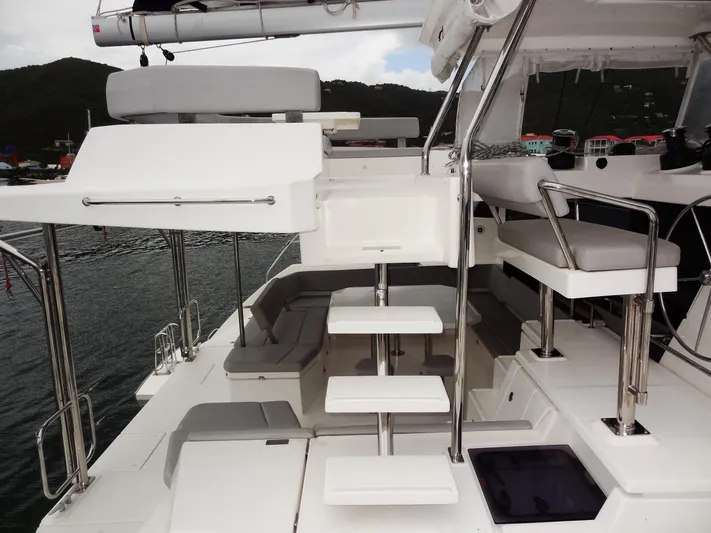 Voila Yacht Photos Pics Modern Leopard 50 yacht interior, 2020 model, featuring sleek white seating and steps.