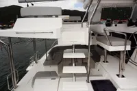 Modern Leopard 50 yacht interior, 2020 model, featuring sleek white seating and steps.