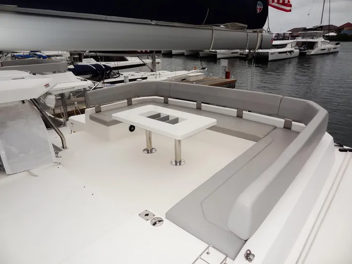 Voila Yacht Photos Pics Modern Leopard 50 yacht, 2020 model, featuring spacious outdoor seating and table.