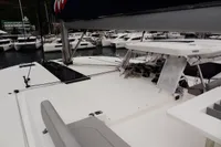 Leopard 50 catamaran, 2020 model, docked at a marina with other boats in the background.