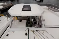 Leopard 50 catamaran 2020 model docked at marina with clear cockpit enclosure.