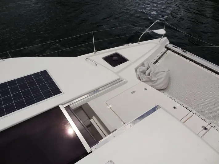 Voila Yacht Photos Pics Leopard 50 catamaran deck with solar panel, netting, and water view, 2020 model.
