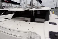Leopard 50 catamaran, 2020 model, docked at marina, spacious deck and modern design.