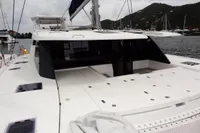 Leopard 50 catamaran, 2020 model, docked in a marina with scenic hillside background.