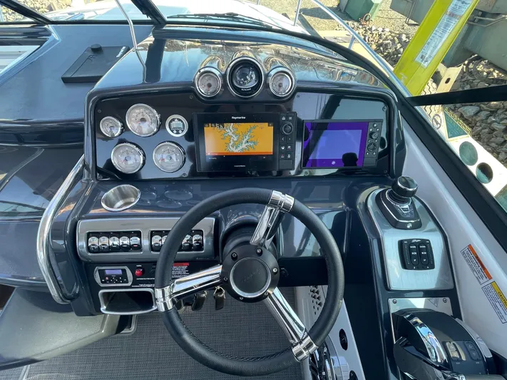 $30k Price Reduction! Yacht Photos Pics Control panel of a 2020 Formula 350 Sun Sport boat with navigation screens and gauges.