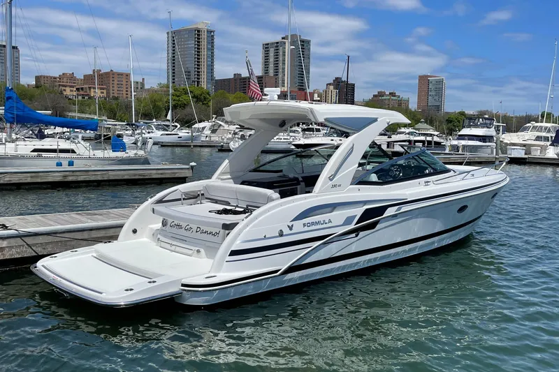 $30k Price Reduction! Yacht Photos Pics 2020 Formula 350 Sun Sport boat docked in a marina with city skyline.