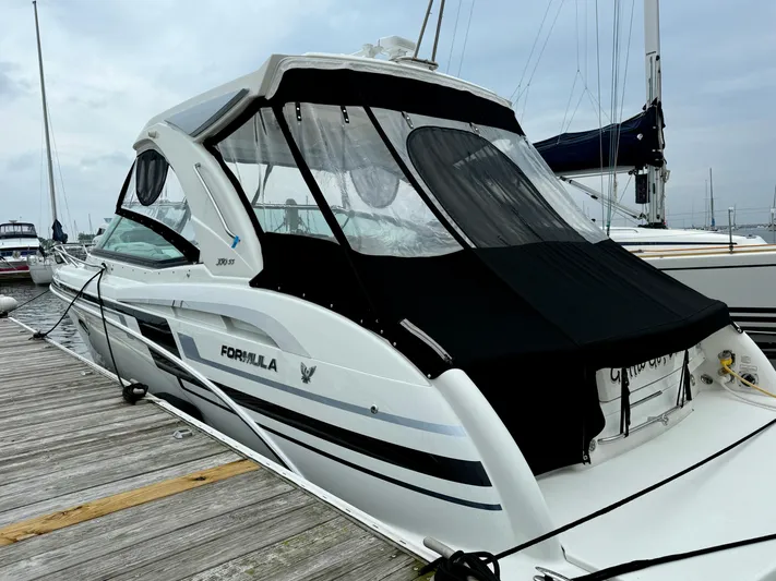 $30k Price Reduction! Yacht Photos Pics 2020 Formula 350 Sun Sport boat docked at a marina, featuring sleek design and black canopy.