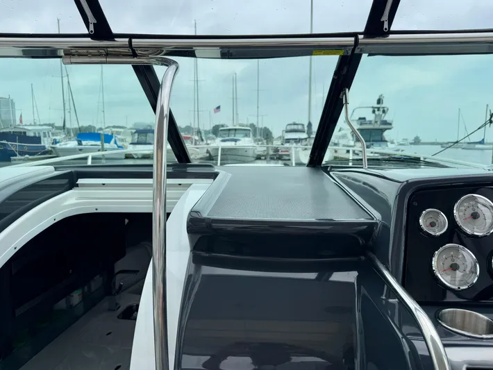 $30k Price Reduction! Yacht Photos Pics 2020 Formula 350 Sun Sport boat interior with dashboard and marina view.