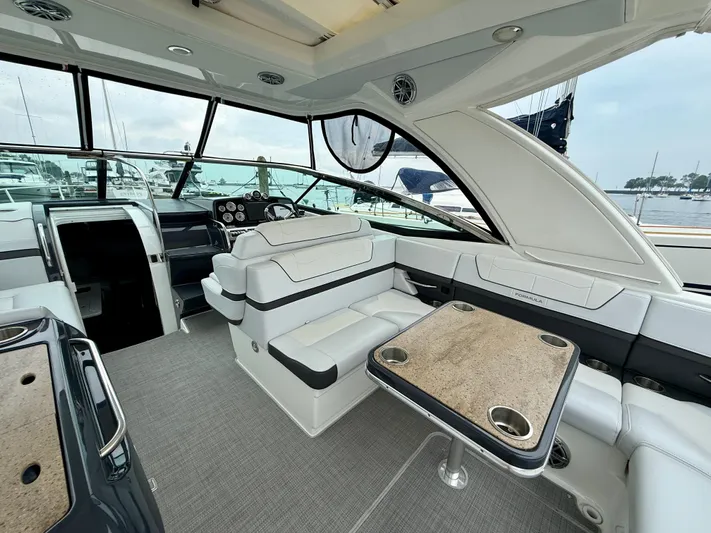 $30k Price Reduction! Yacht Photos Pics 2020 Formula 350 Sun Sport yacht interior with luxurious seating and table, docked at marina.
