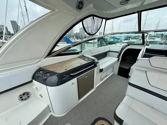 $30k Price Reduction! Yacht Photos Pics 2020 Formula 350 Sun Sport boat interior with seating and kitchenette, docked at marina.