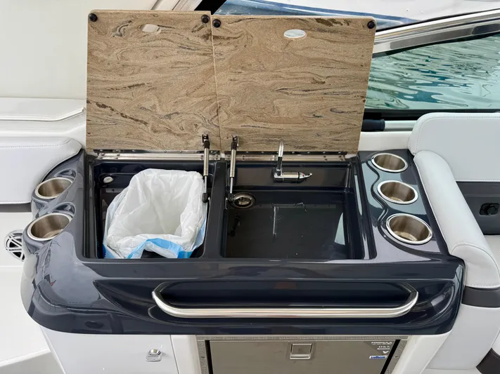$30k Price Reduction! Yacht Photos Pics 2020 Formula 350 Sun Sport boat kitchenette with sink, trash bin, and cup holders.