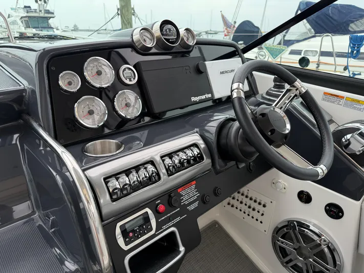 $30k Price Reduction! Yacht Photos Pics 2020 Formula 350 Sun Sport dashboard with gauges, steering wheel, and control panel.
