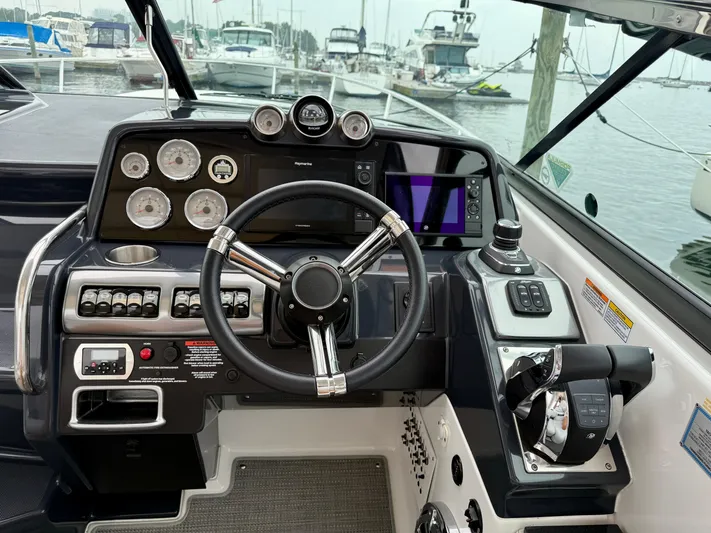 $30k Price Reduction! Yacht Photos Pics 2020 Formula 350 Sun Sport boat dashboard with steering wheel and control panel.