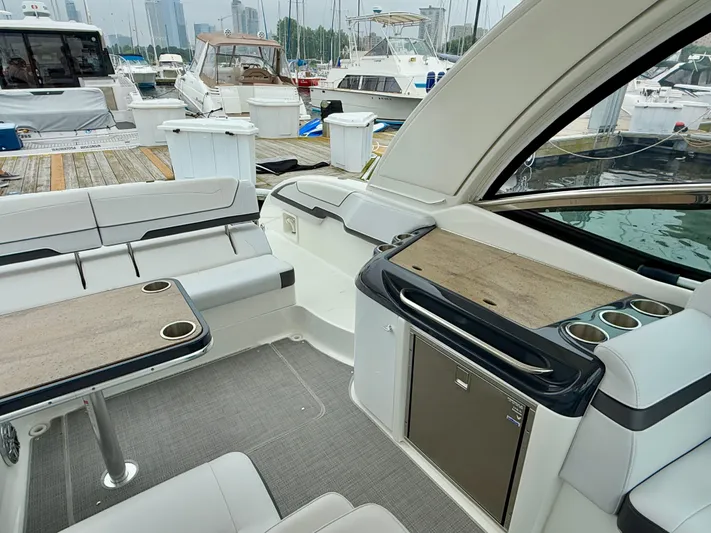 $30k Price Reduction! Yacht Photos Pics 2020 Formula 350 Sun Sport yacht interior with seating and table, docked at marina.