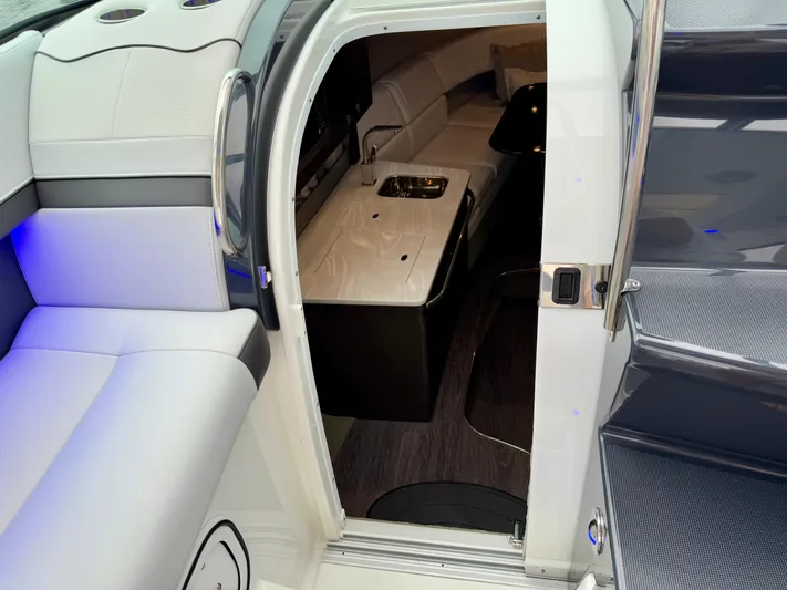 $30k Price Reduction! Yacht Photos Pics 2020 Formula 350 Sun Sport interior with seating, kitchenette, and modern design.