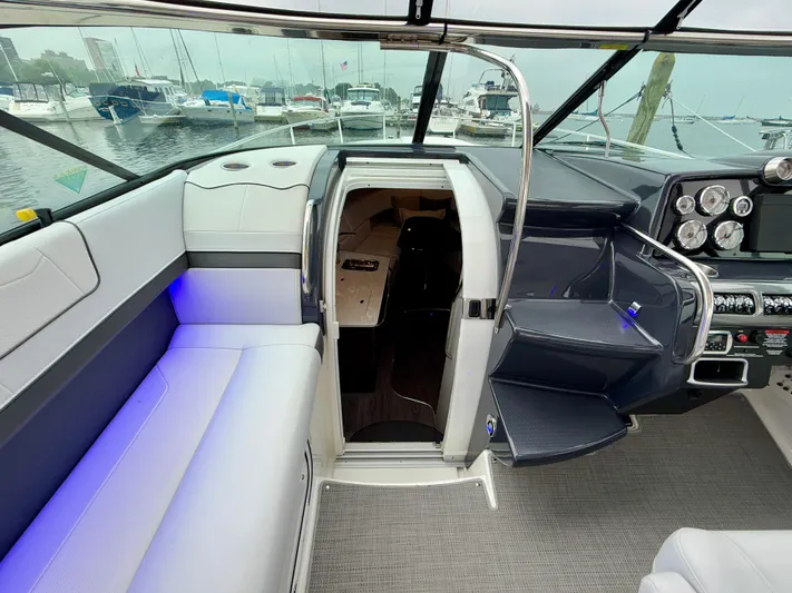 $30k Price Reduction! Yacht Photos Pics 2020 Formula 350 Sun Sport boat interior with seating, dashboard, and cabin entrance.