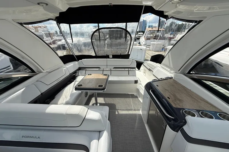 $30k Price Reduction! Yacht Photos Pics 2020 Formula 350 Sun Sport boat interior with seating, table, and kitchenette.