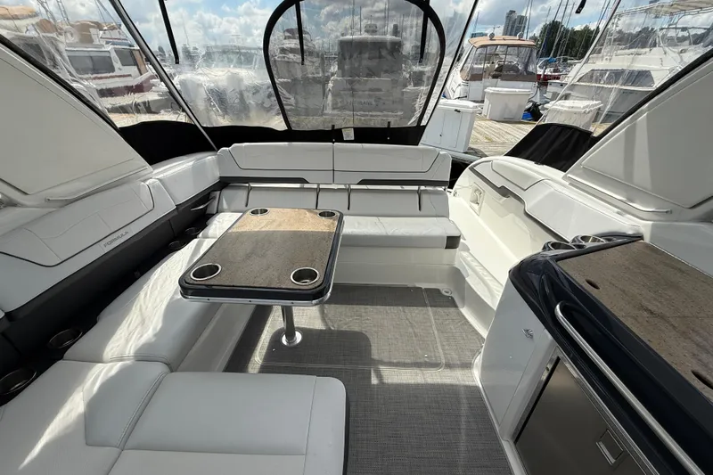 $30k Price Reduction! Yacht Photos Pics Interior of a 2020 Formula 350 Sun Sport boat with seating and table.