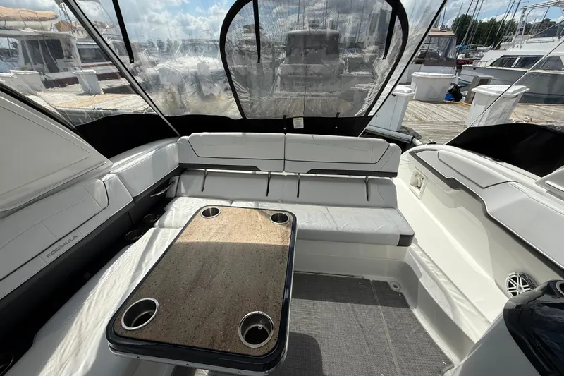 $30k Price Reduction! Yacht Photos Pics 2020 Formula 350 Sun Sport boat interior with seating and table, docked at marina.