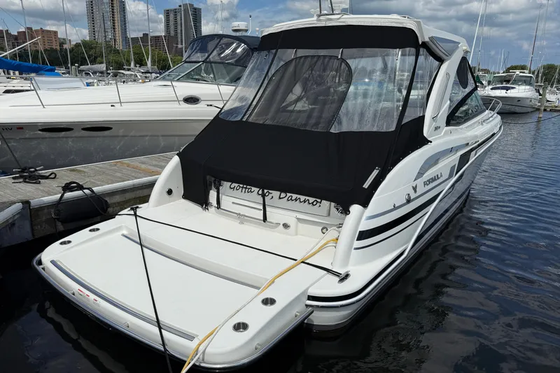 $30k Price Reduction! Yacht Photos Pics 2020 Formula 350 Sun Sport boat docked at marina with city skyline.