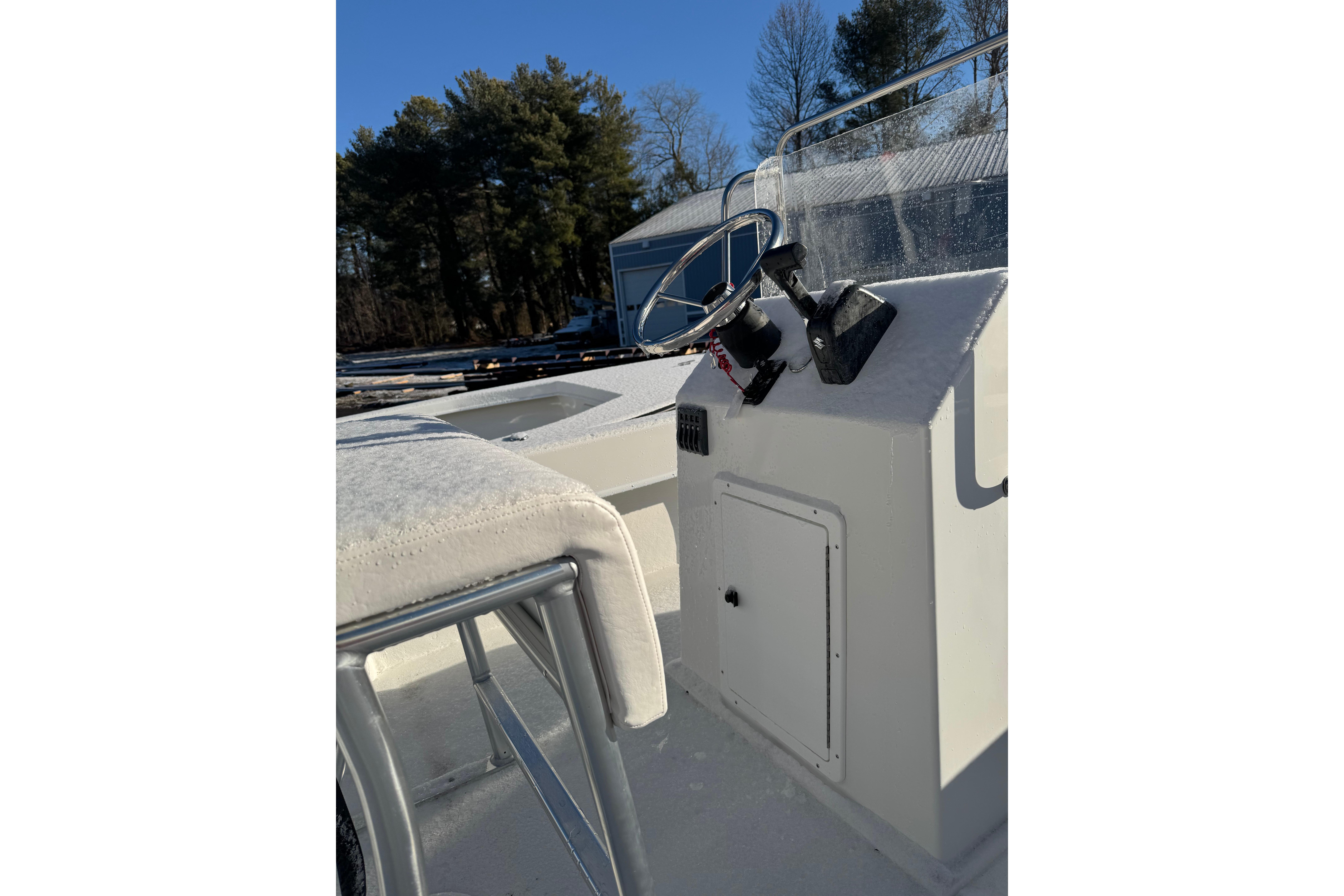 2026 C-Hawk 200 Center Console boat interior with steering wheel and controls.