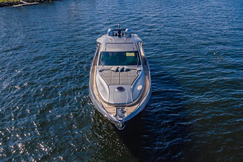 Argo Yacht Photos Pics 2017 Pershing 70 yacht cruising on open water, aerial view.