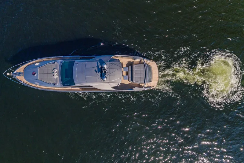 Argo Yacht Photos Pics Aerial view of a 2017 Pershing 70 yacht cruising on the water.